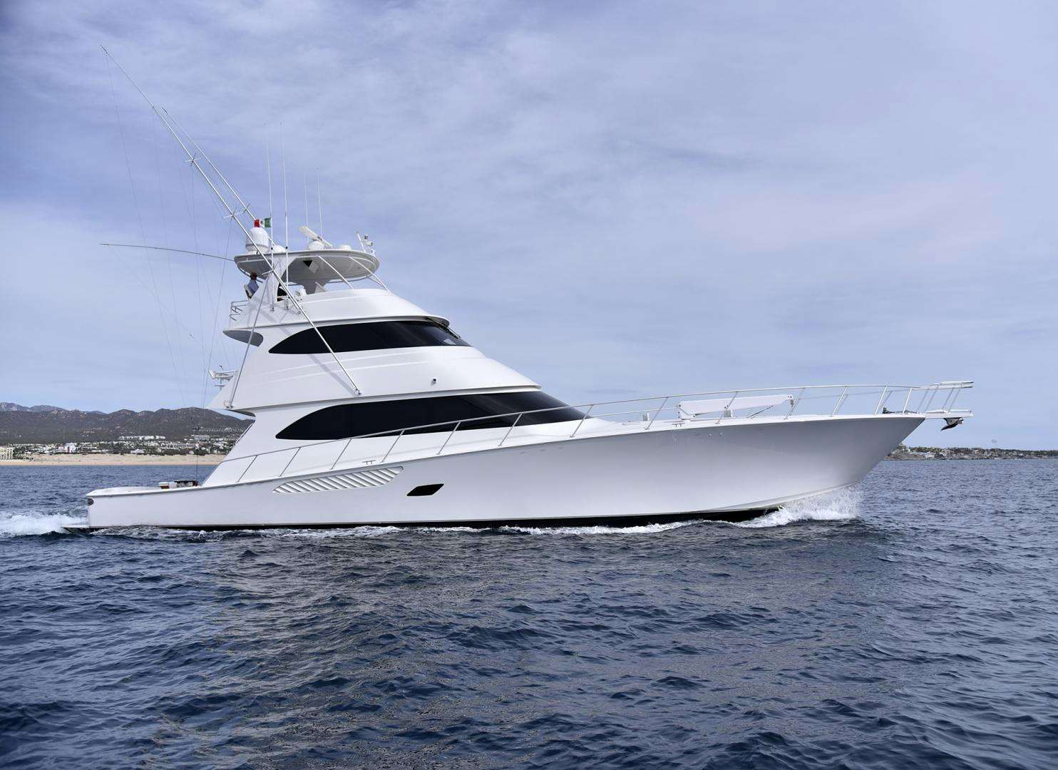 a white yacht on the water aboard SALTY K Yacht for Sale