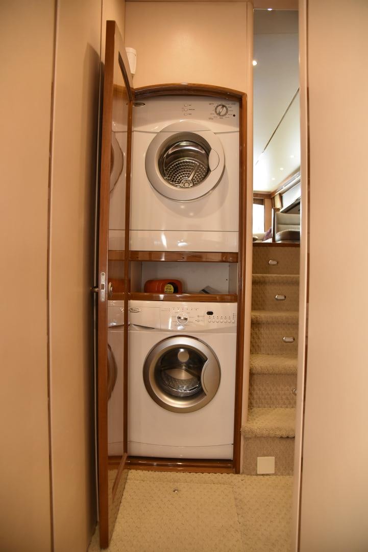 a washer and dryer in a room aboard SALTY K Yacht for Sale