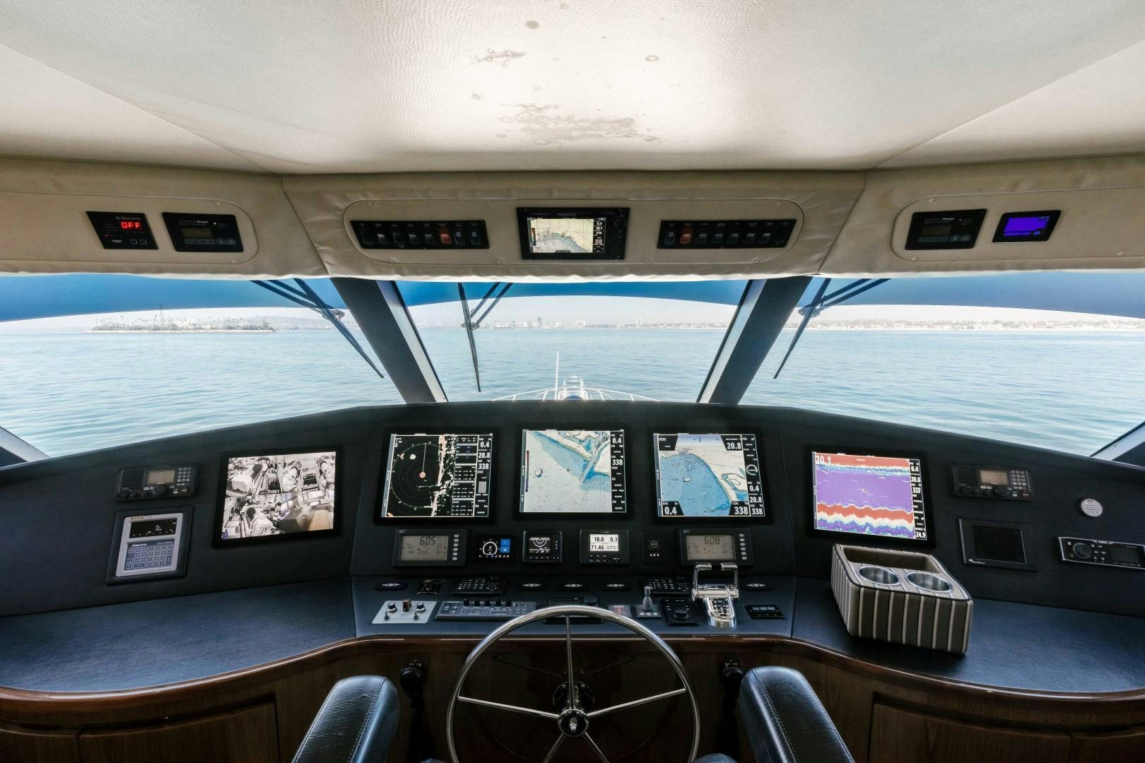 inside of a vehicle with monitors and keyboards aboard SALTY K Yacht for Sale