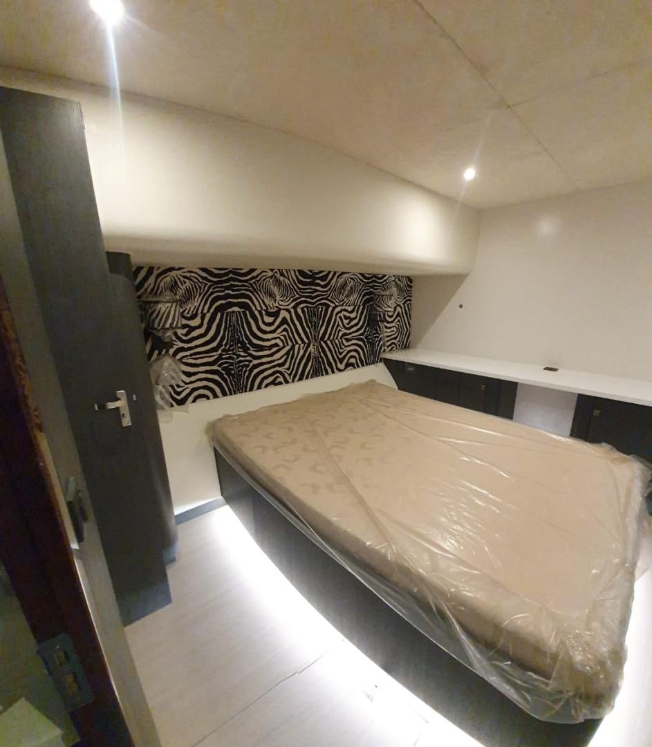 a bed in a room aboard SKYE Yacht for Sale