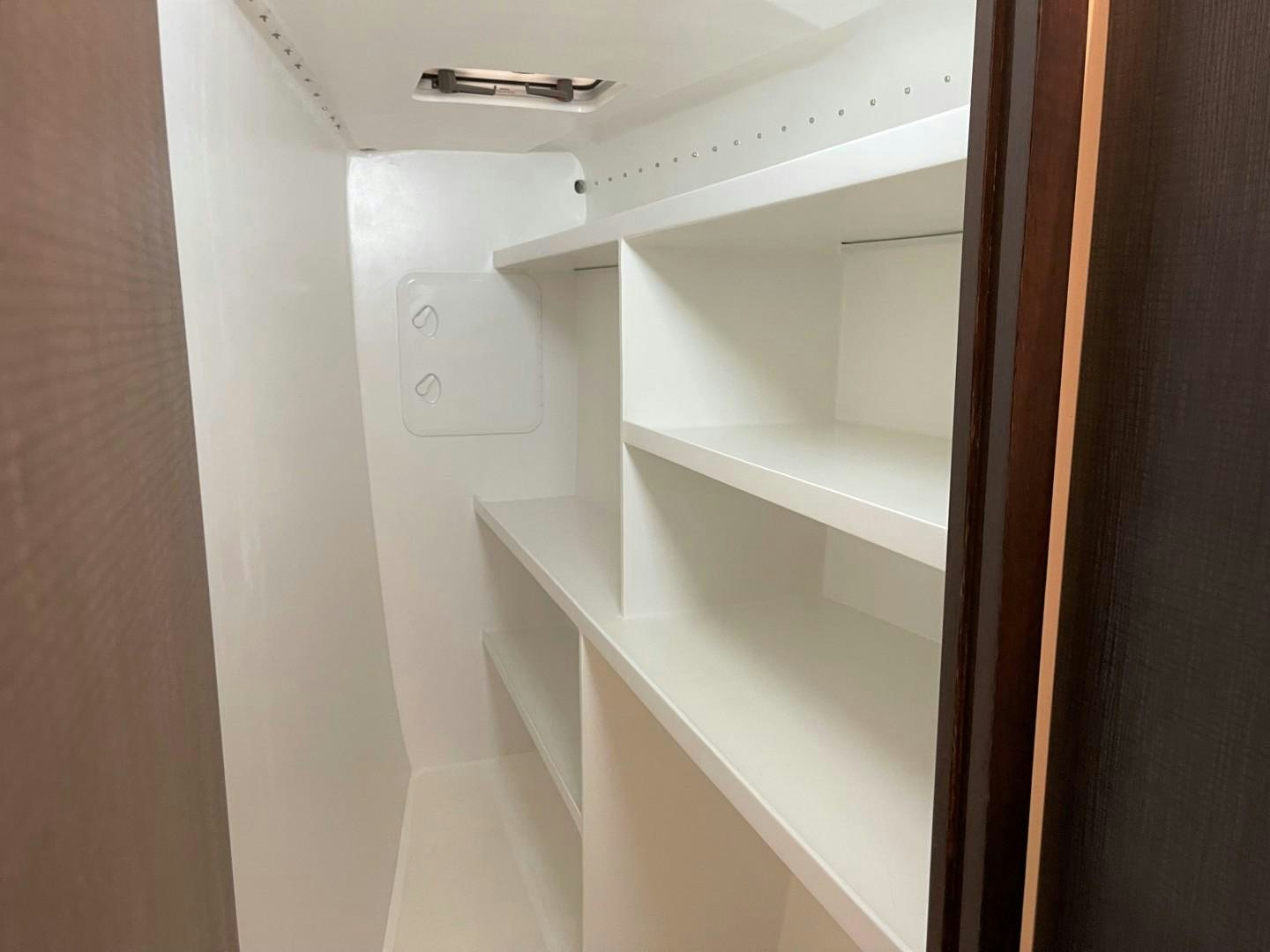 a white cabinet with a vent aboard SKYE Yacht for Sale