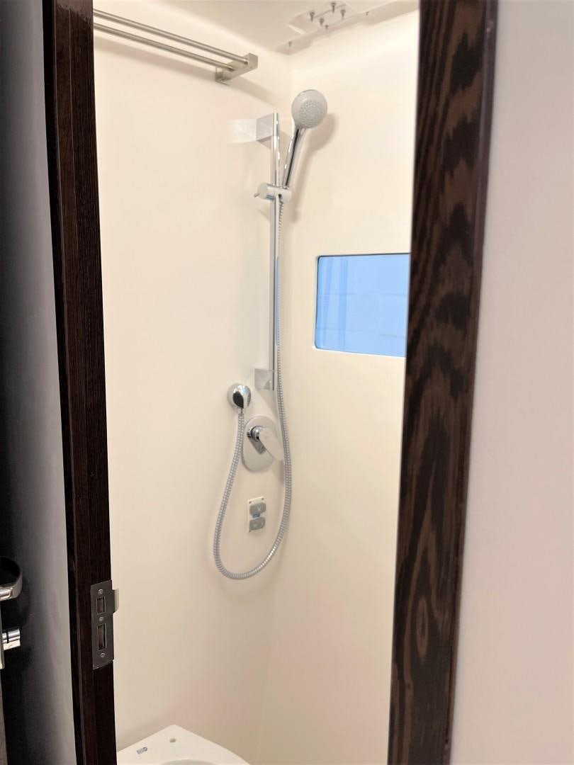 a shower head with a blue screen aboard SKYE Yacht for Sale