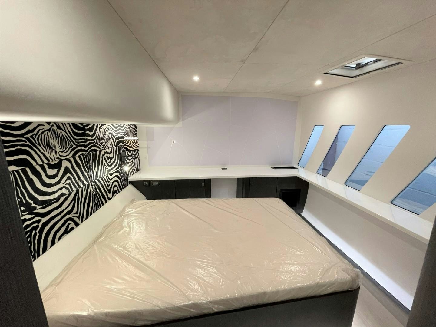a bed in a room aboard SKYE Yacht for Sale