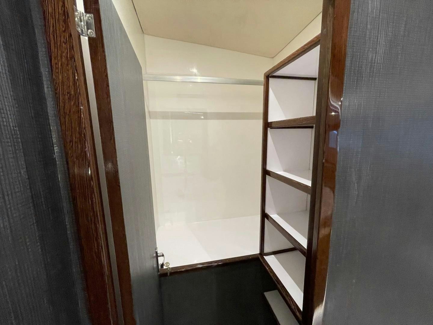 a white door with a shelf aboard SKYE Yacht for Sale