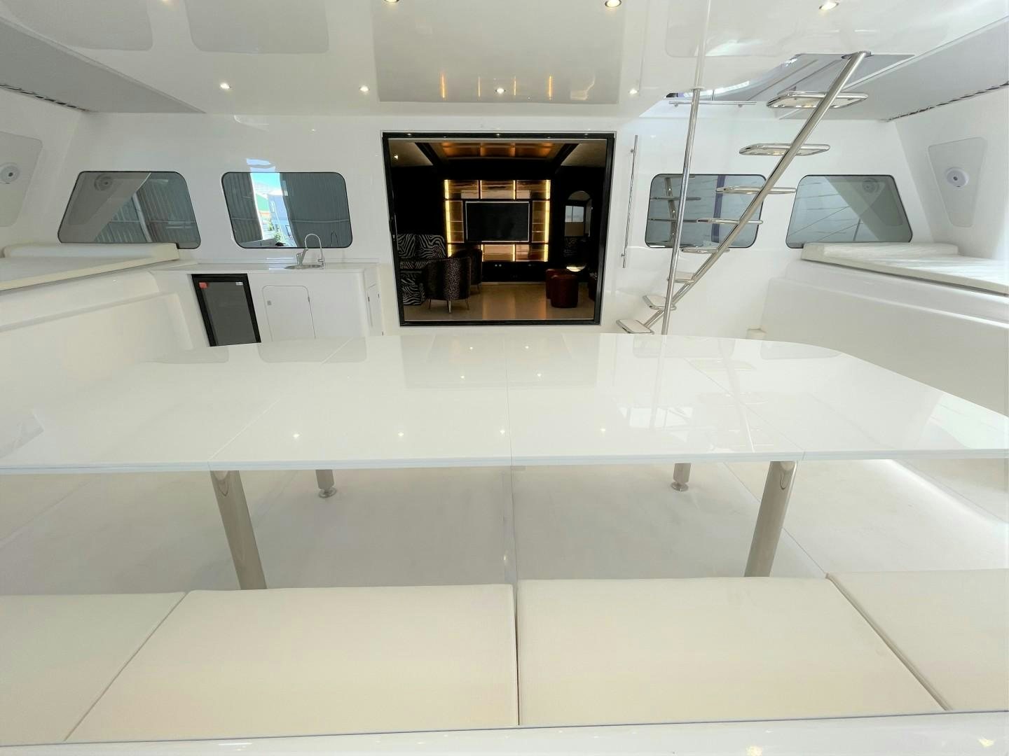 a room with a large window and a few computers on the wall aboard SKYE Yacht for Sale