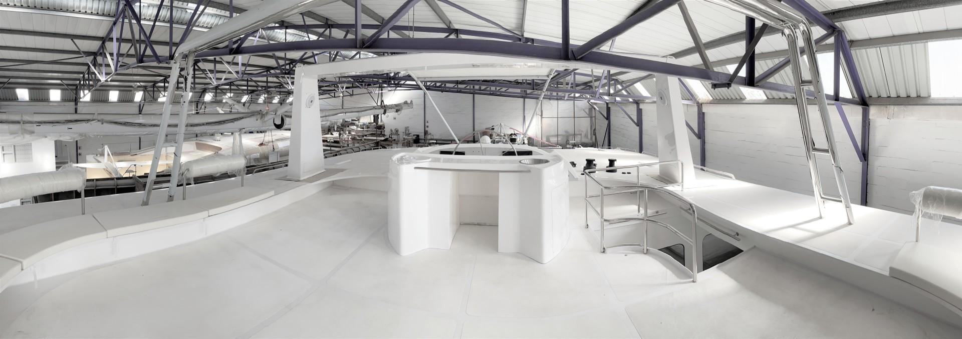 a room with tables and chairs aboard SKYE Yacht for Sale