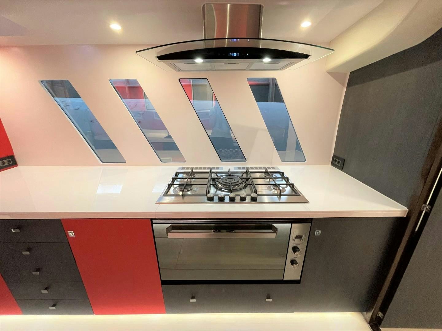 a kitchen with a stove and a sign on the wall aboard SKYE Yacht for Sale