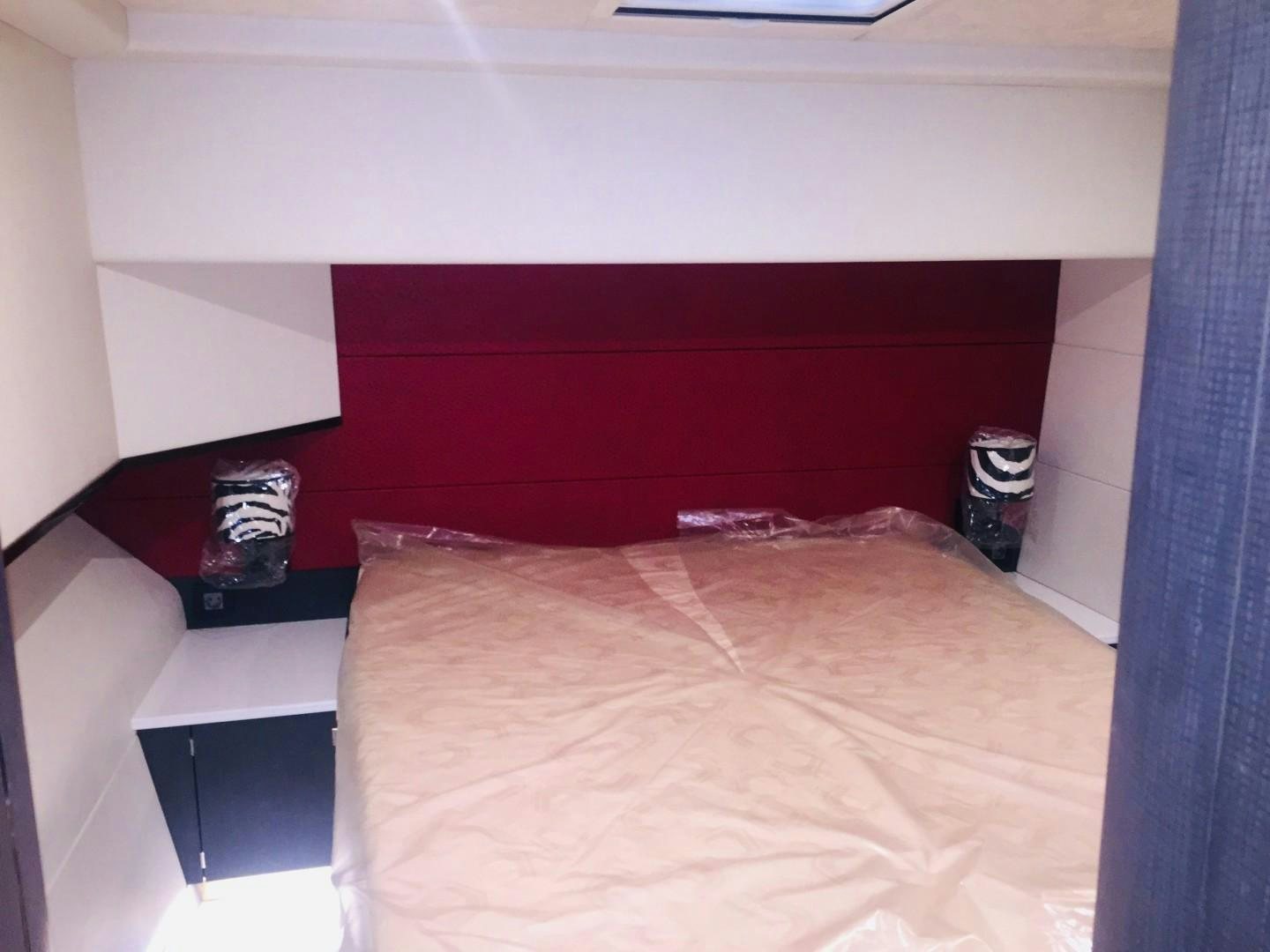 a bed with a brown blanket aboard SKYE Yacht for Sale