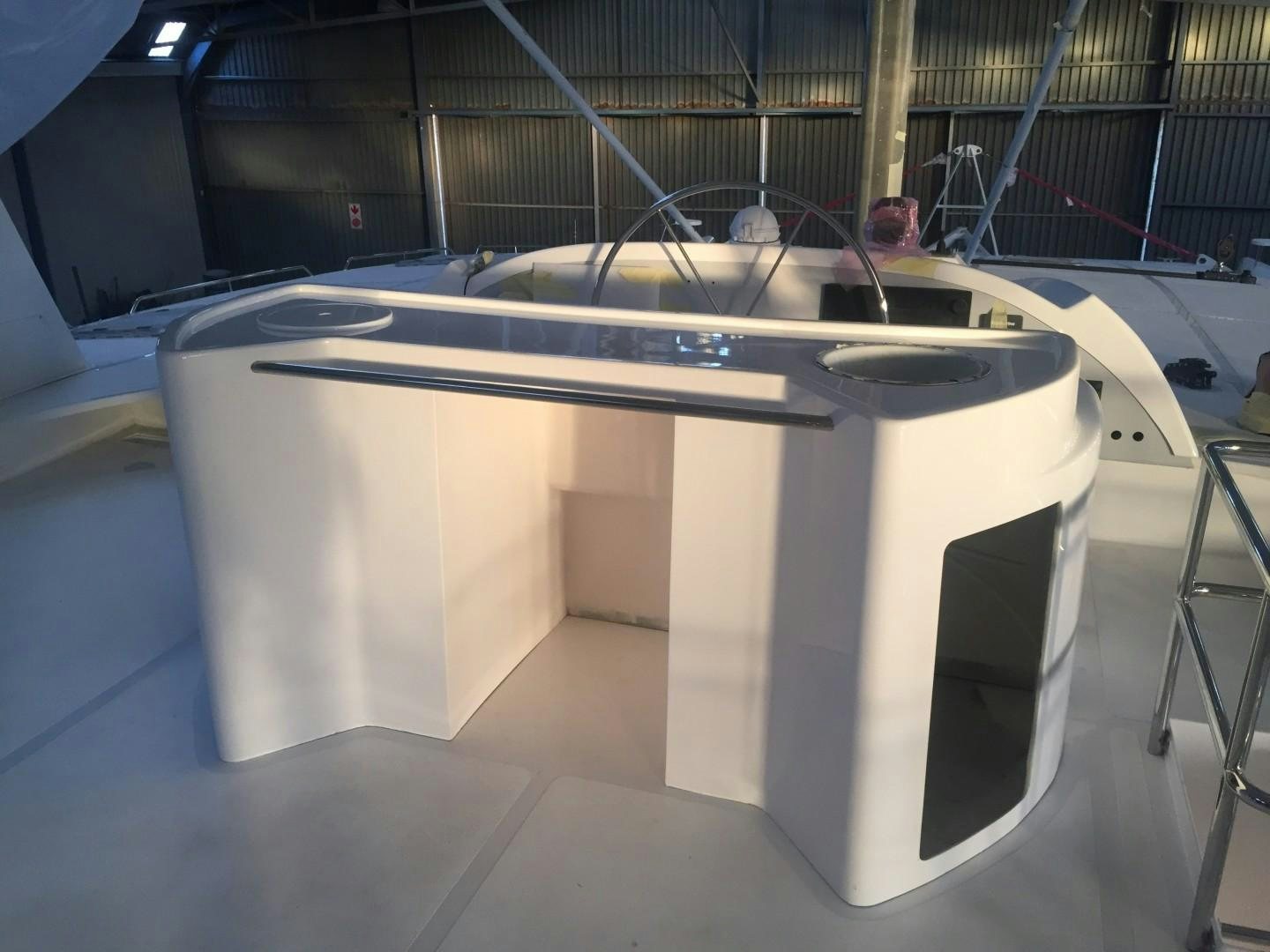 a white rectangular object with a black handle on a black surface aboard SKYE Yacht for Sale