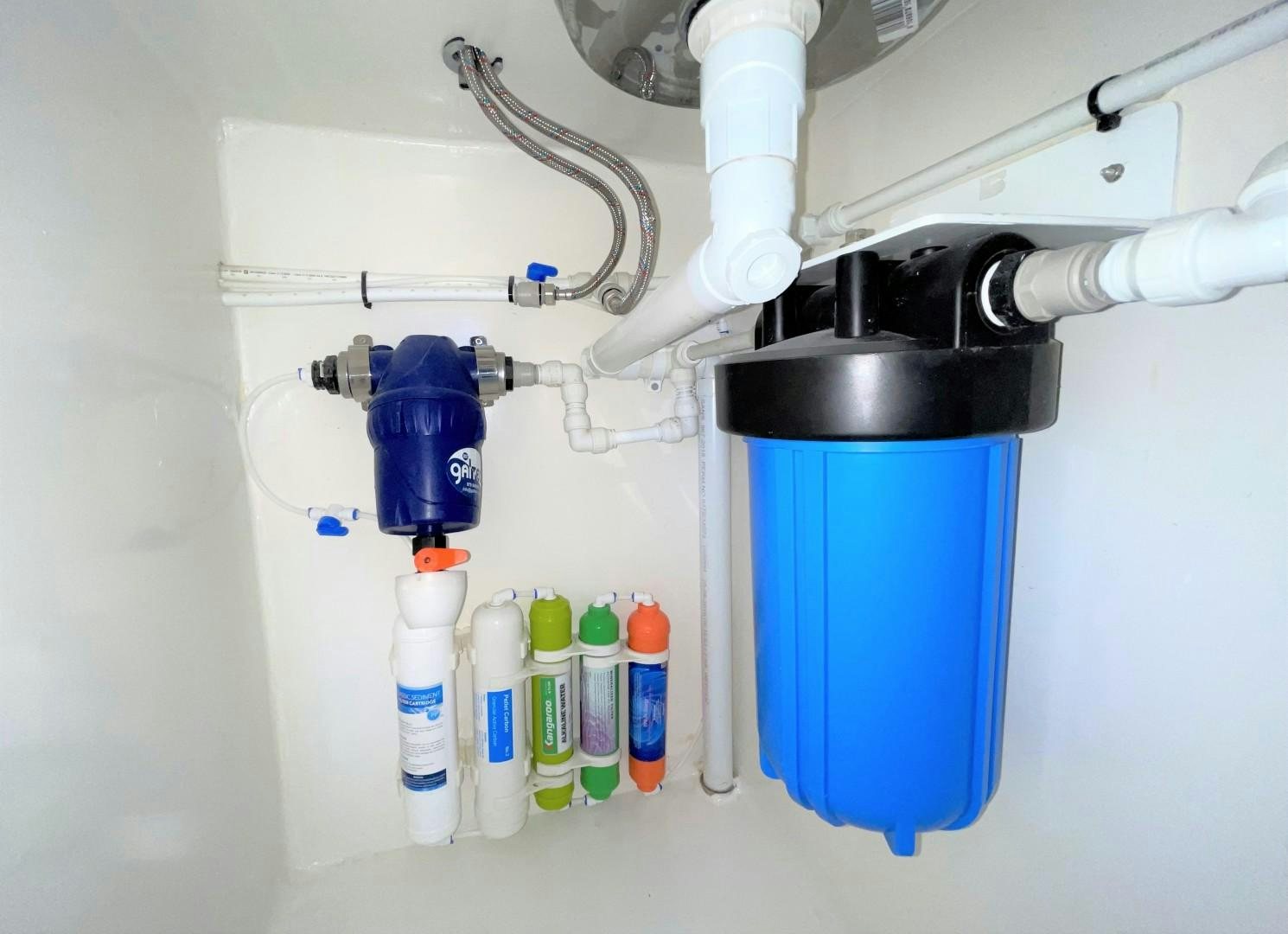 a blue container with a blue container and a blue container with white liquid aboard SKYE Yacht for Sale