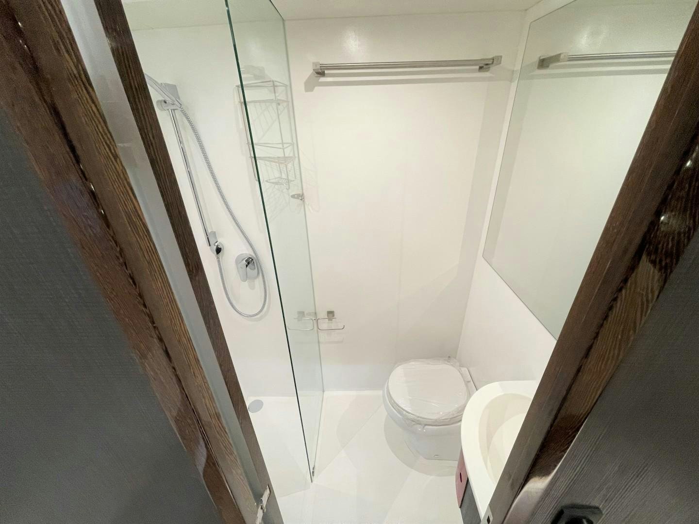 a bathroom with a shower unit aboard SKYE Yacht for Sale