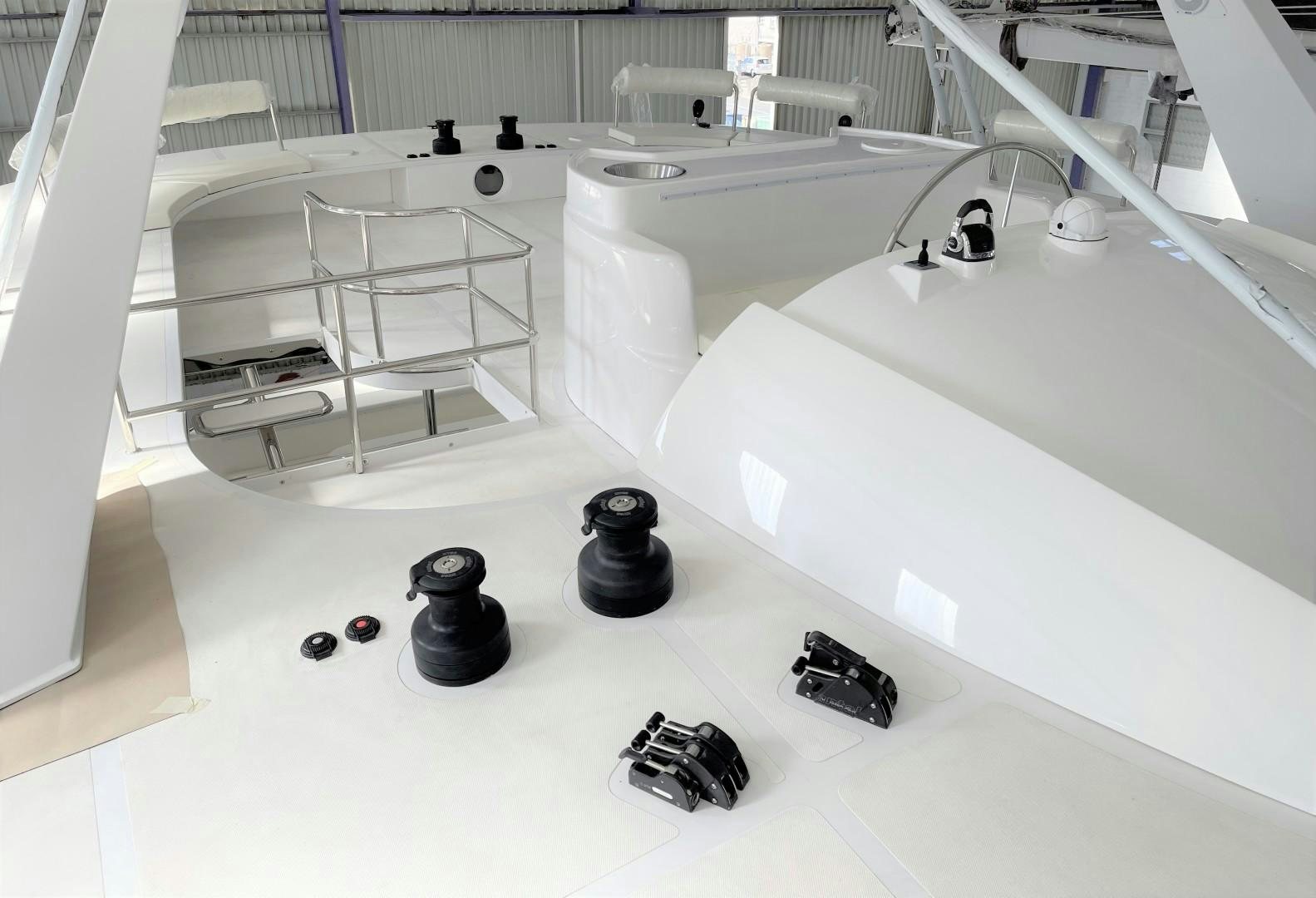 a white room with a white table and chairs aboard SKYE Yacht for Sale