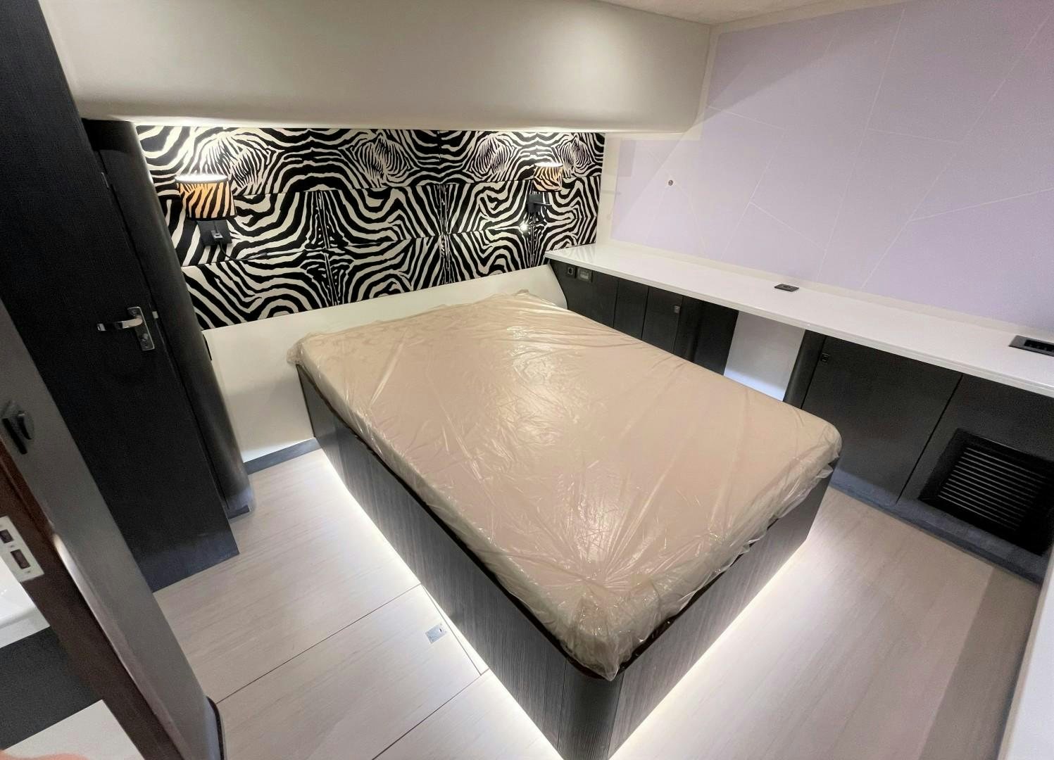 a bed in a room aboard SKYE Yacht for Sale