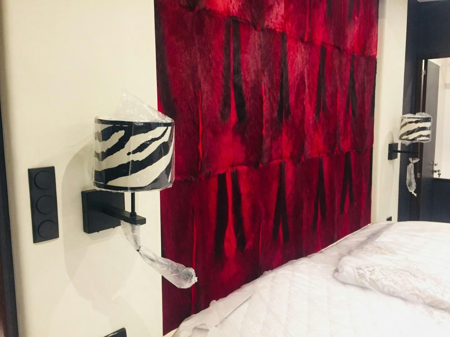 a red curtain with a white and black striped pillow and a white bed spread aboard SKYE Yacht for Sale
