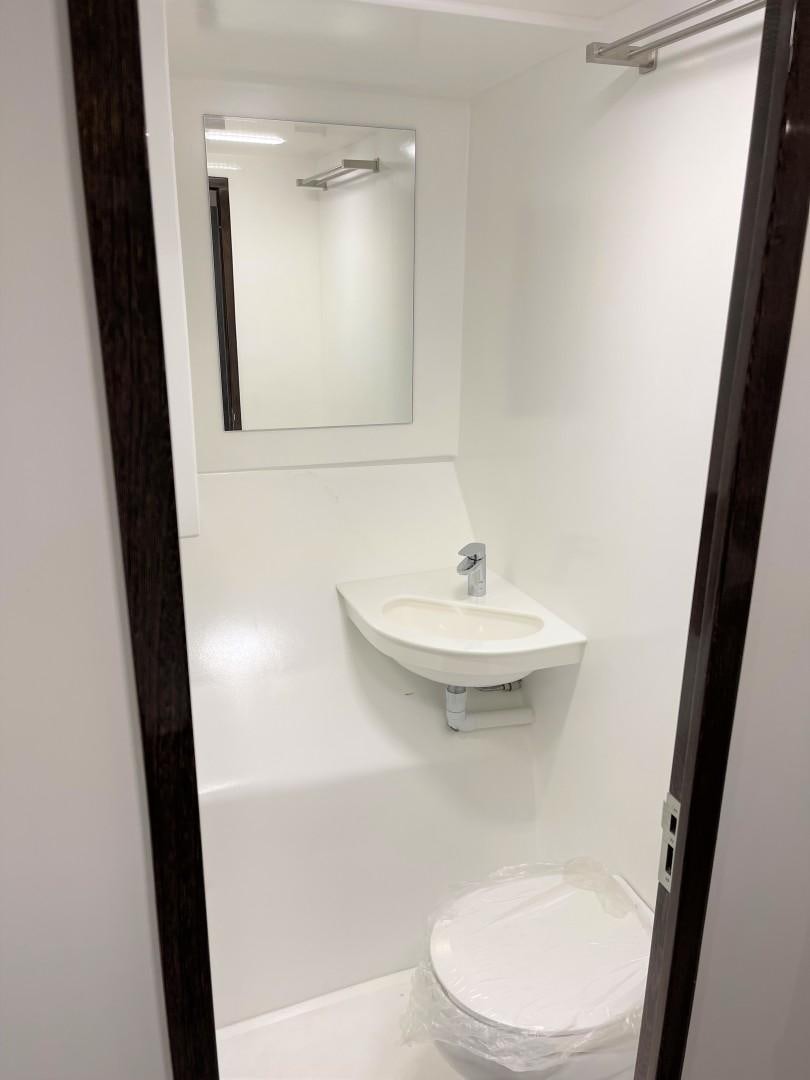 a bathroom with a sink and a mirror aboard SKYE Yacht for Sale
