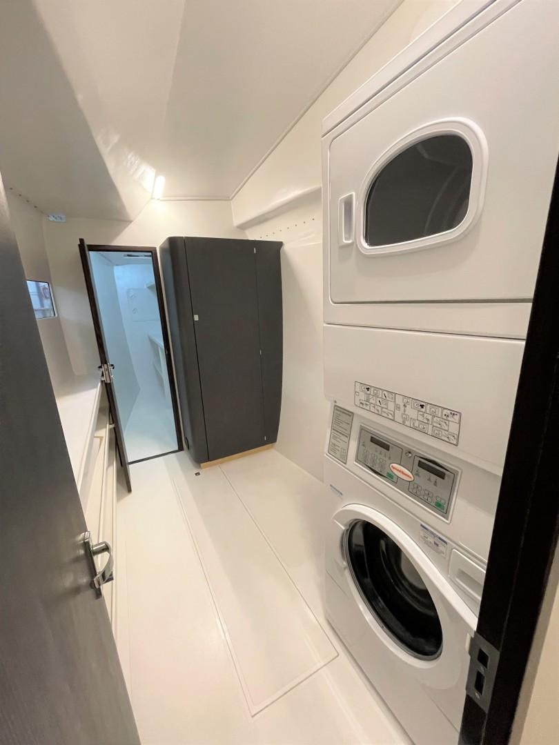 a washer and dryer in a room aboard SKYE Yacht for Sale