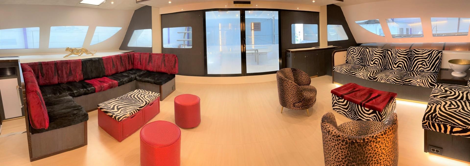 a room with couches and chairs aboard SKYE Yacht for Sale