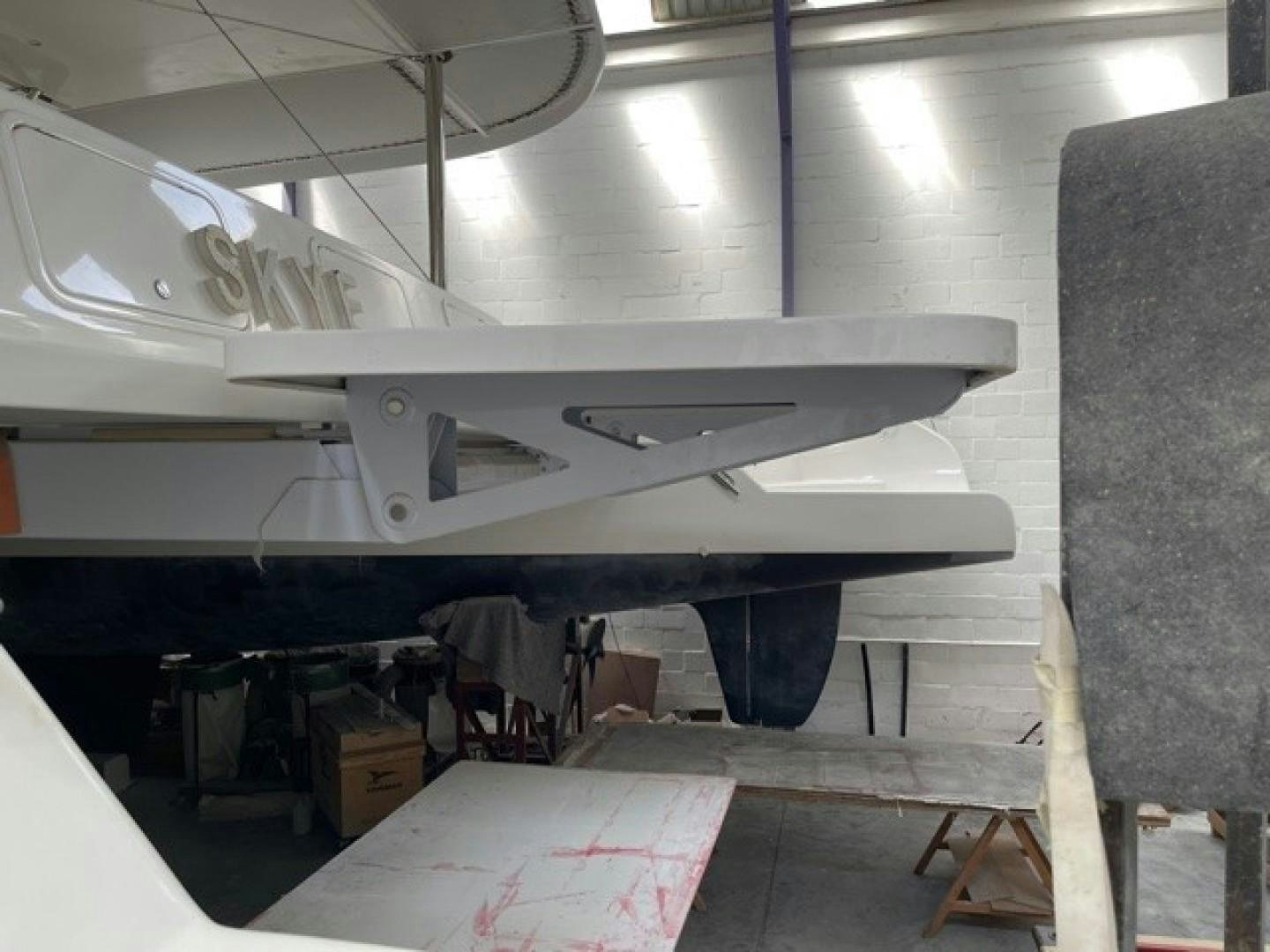 a white airplane in a hangar aboard SKYE Yacht for Sale