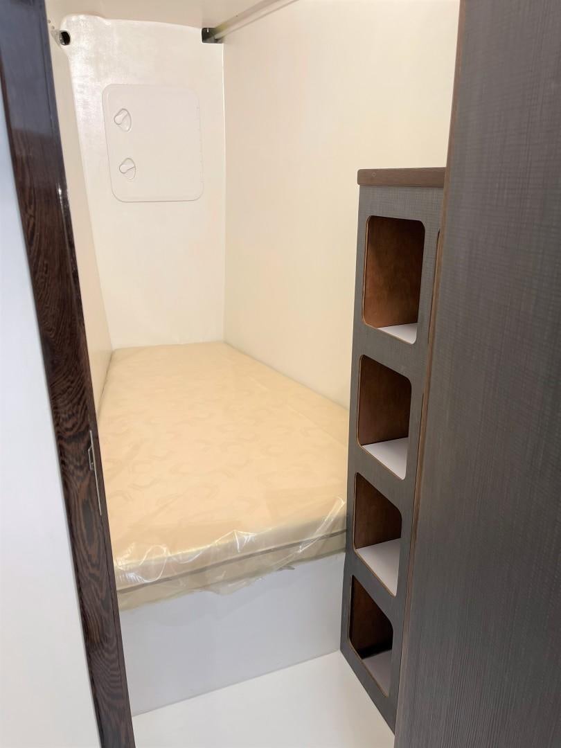 a closet with a shelf and a mirror aboard SKYE Yacht for Sale