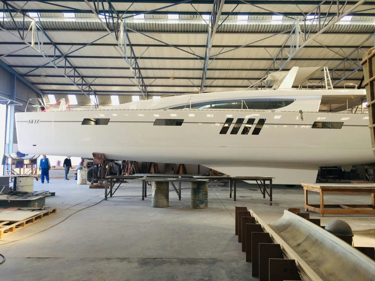 a large white airplane in a hangar aboard SKYE Yacht for Sale