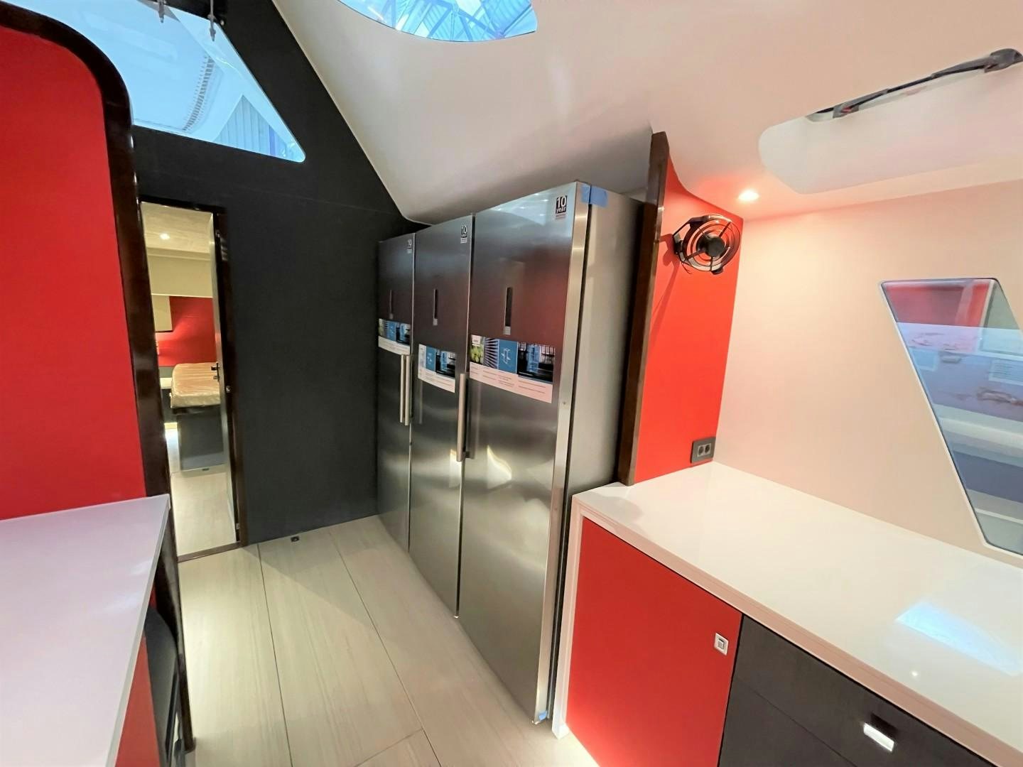 a room with a large refrigerator aboard SKYE Yacht for Sale