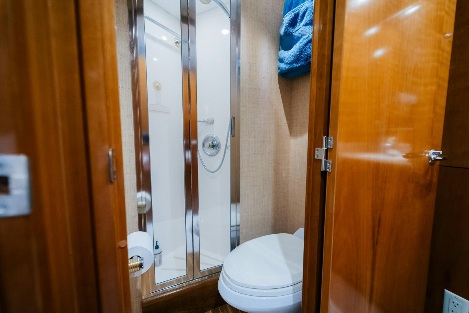 a bathroom with a glass shower aboard Haggis XV Yacht for Sale