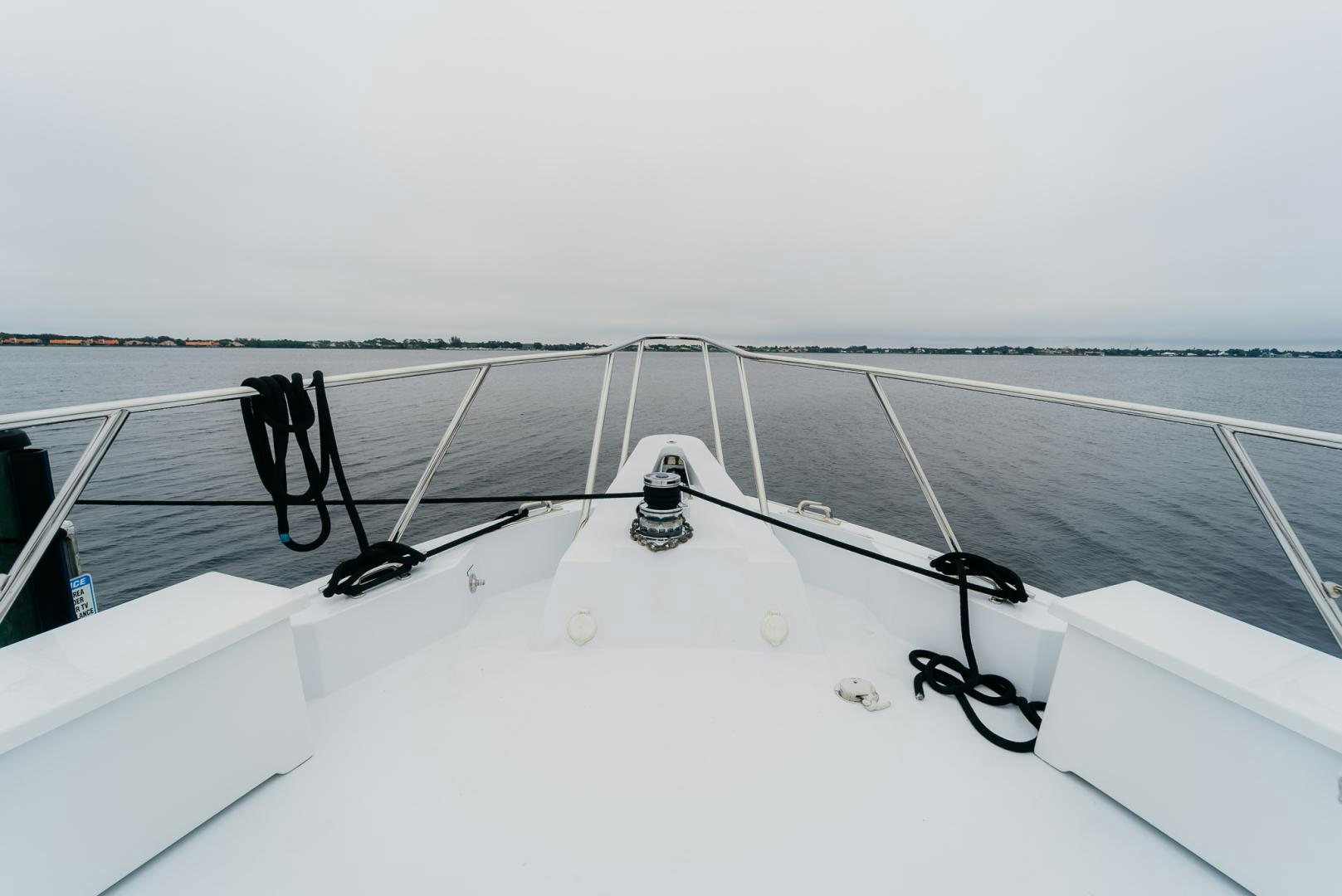 a white boat with ropes aboard Haggis XV Yacht for Sale