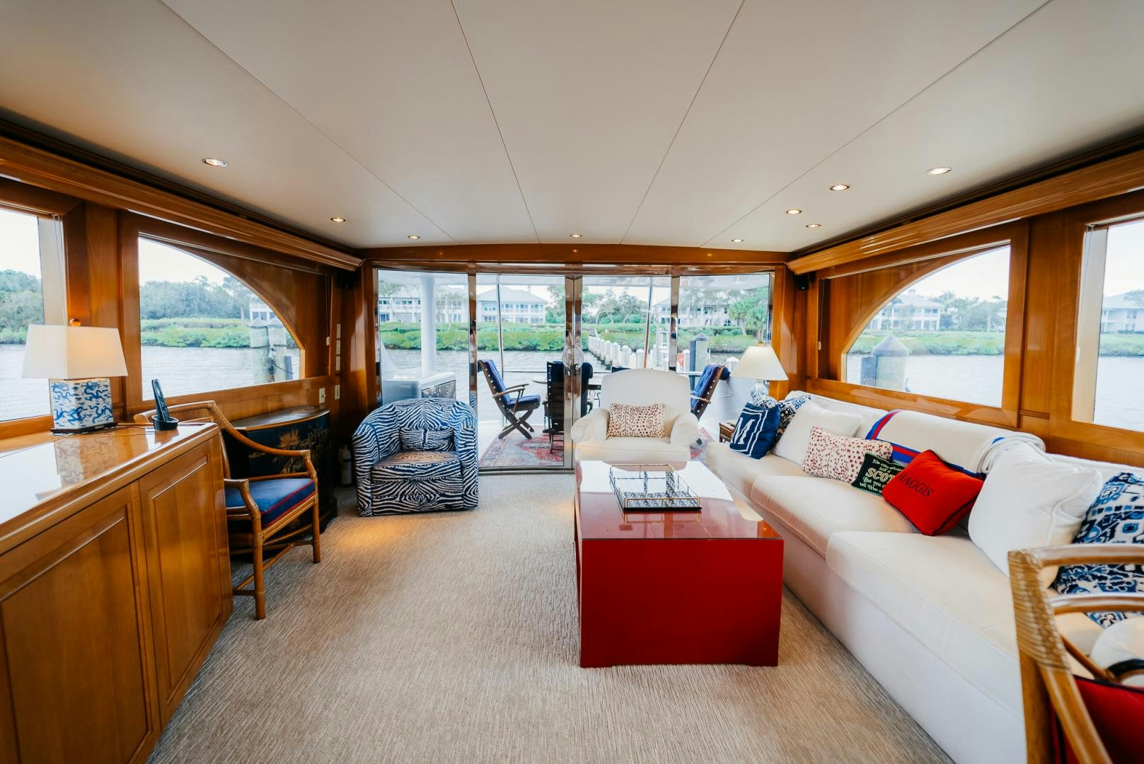 a living room with a large window aboard Haggis XV Yacht for Sale