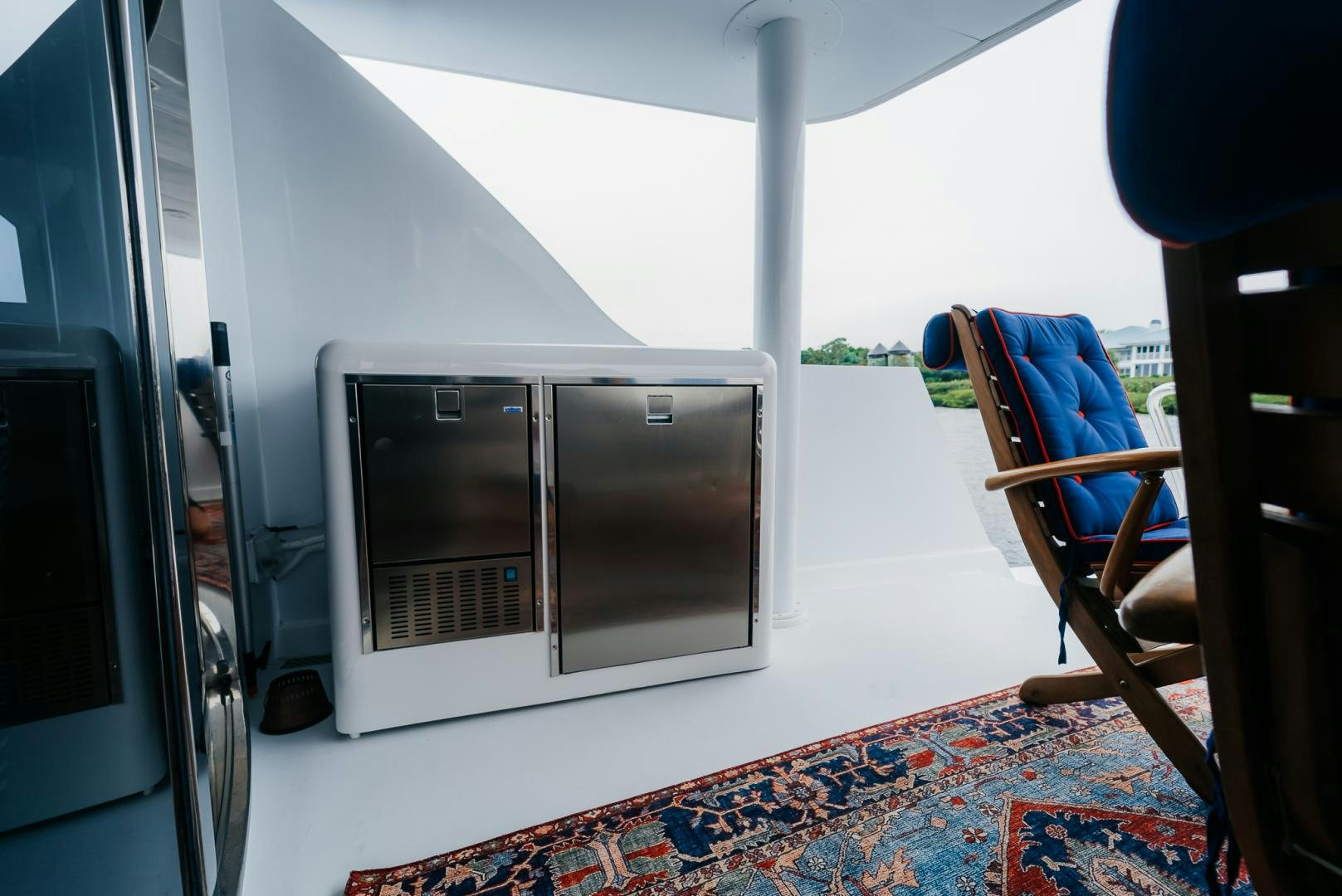 a room with a bed and a chair aboard Haggis XV Yacht for Sale