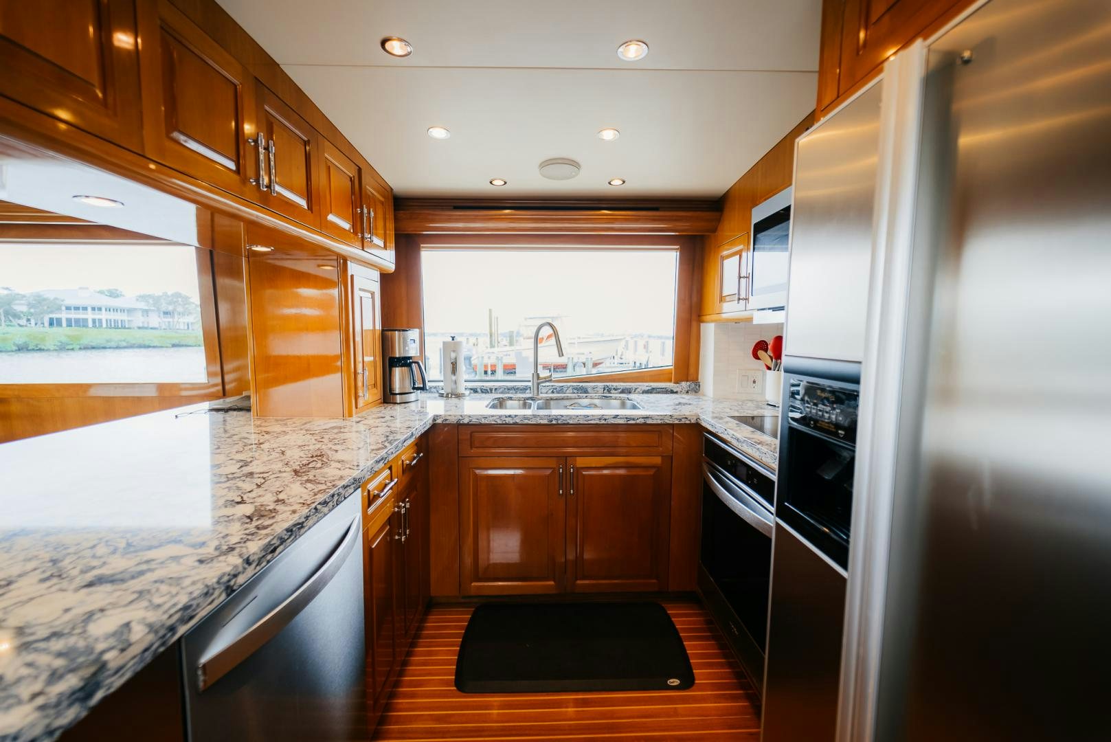 a kitchen with wooden cabinets aboard Haggis XV Yacht for Sale