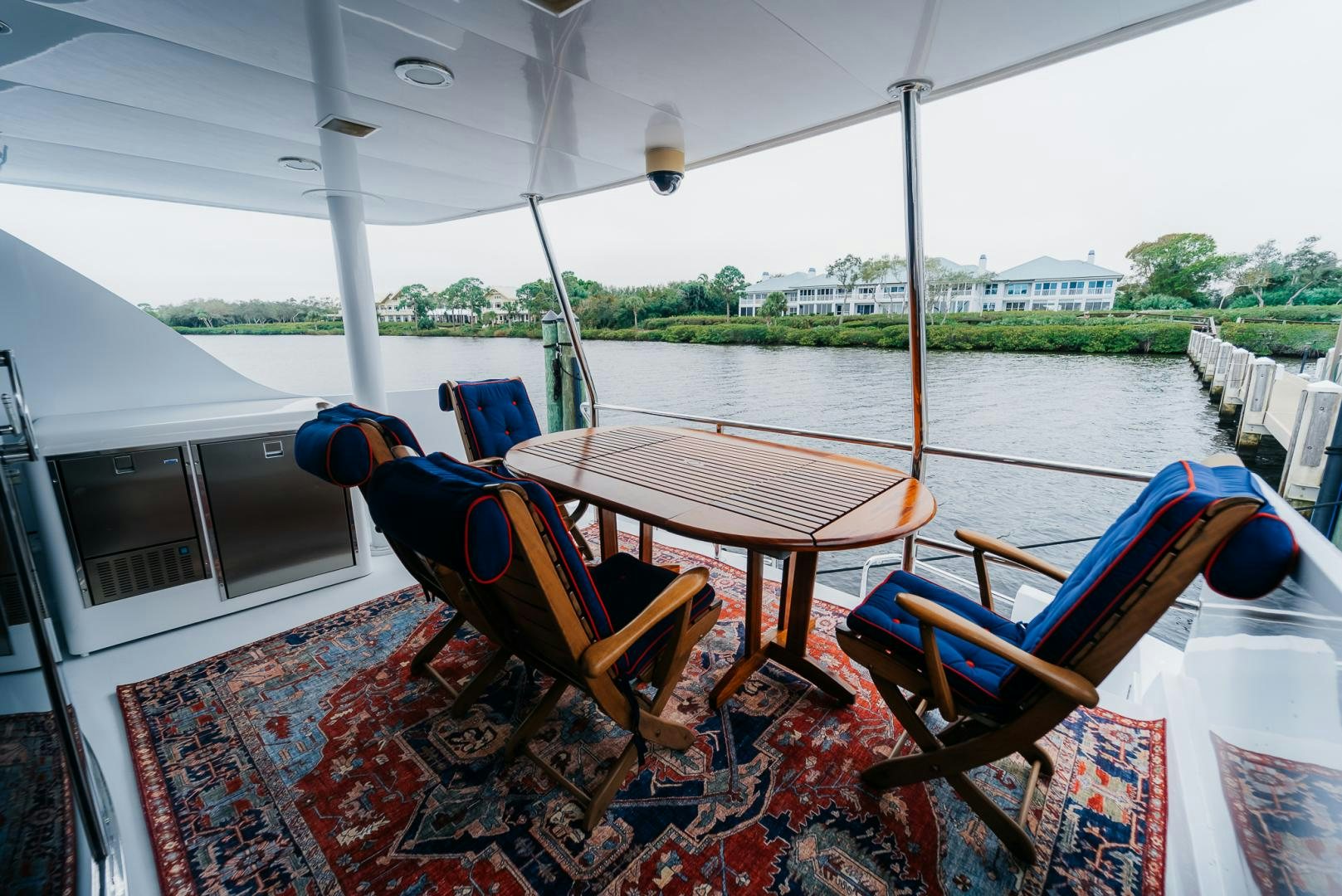 a table and chairs on a boat aboard Haggis XV Yacht for Sale