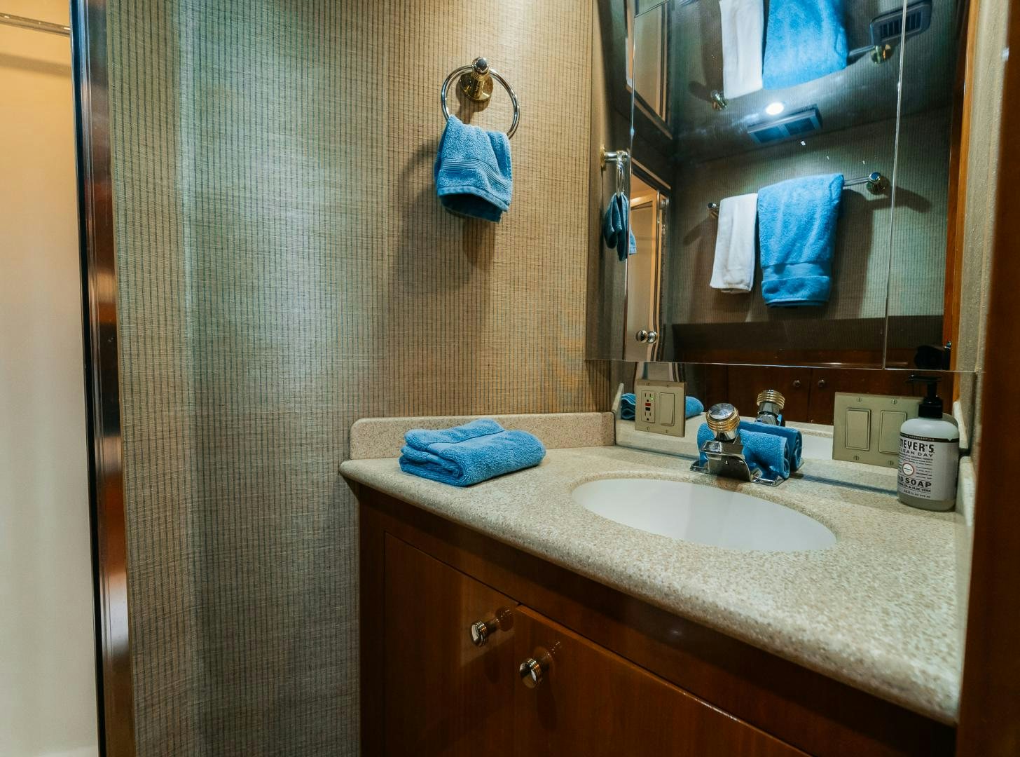 a bathroom with a sink and a mirror aboard Haggis XV Yacht for Sale