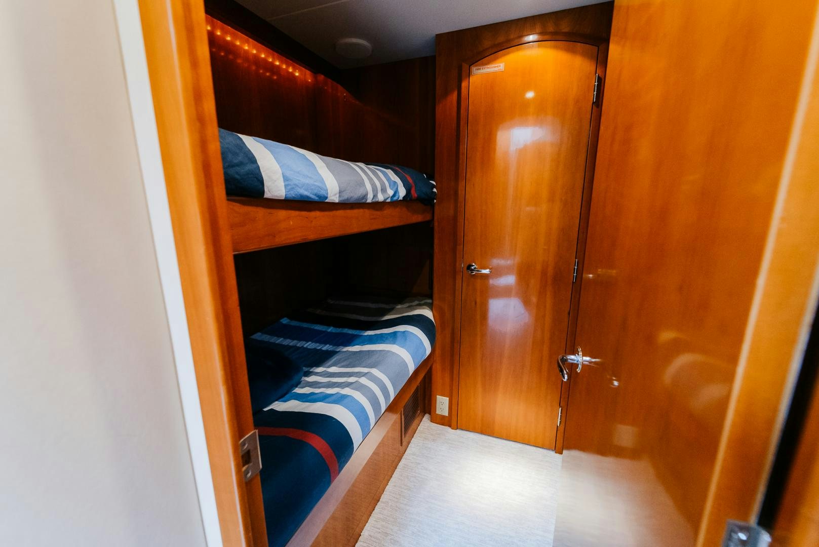 a closet with a bed and a closet aboard Haggis XV Yacht for Sale