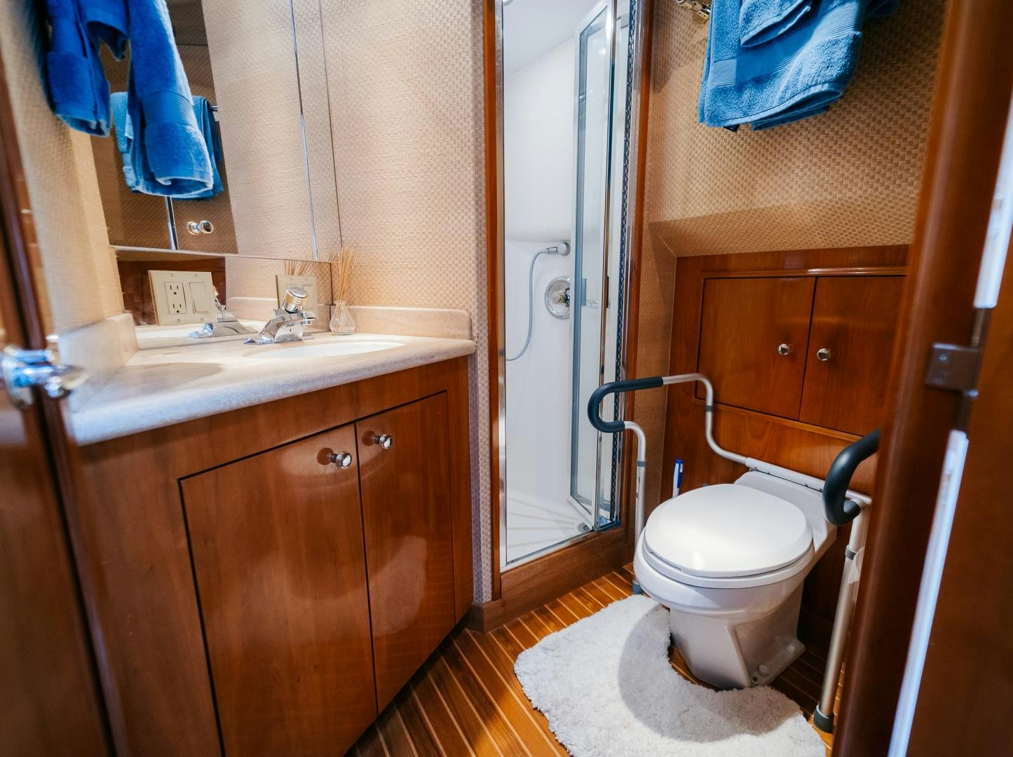 a bathroom with a toilet and sink aboard Haggis XV Yacht for Sale