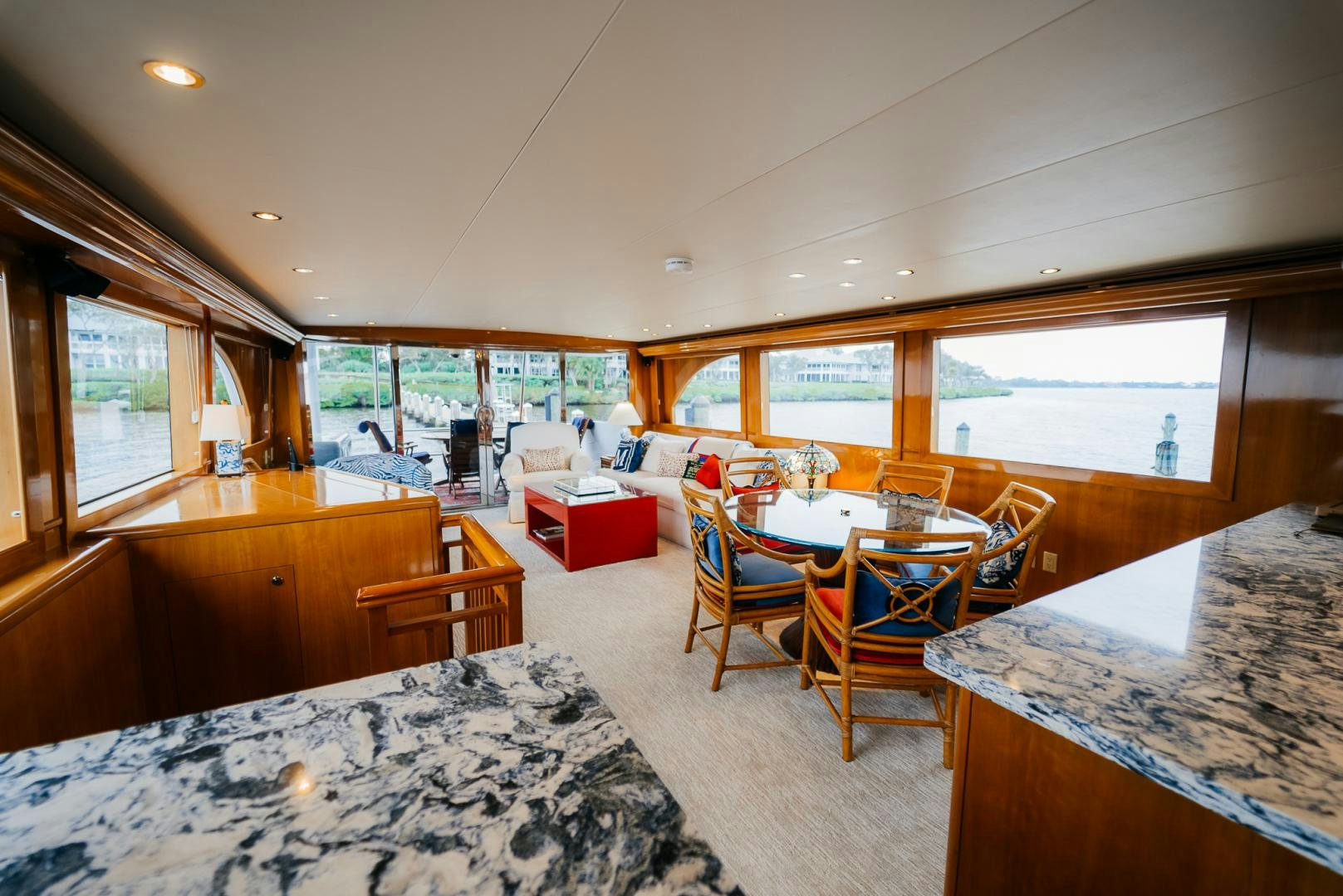 a room with a table chairs and a bed aboard Haggis XV Yacht for Sale