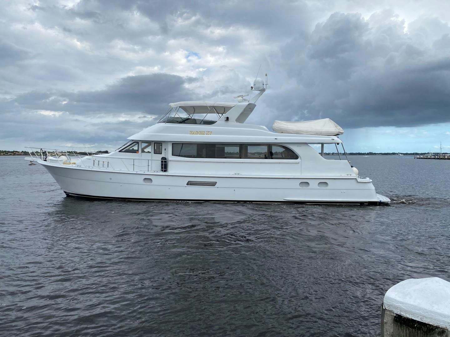 a white yacht in the water aboard Haggis XV Yacht for Sale