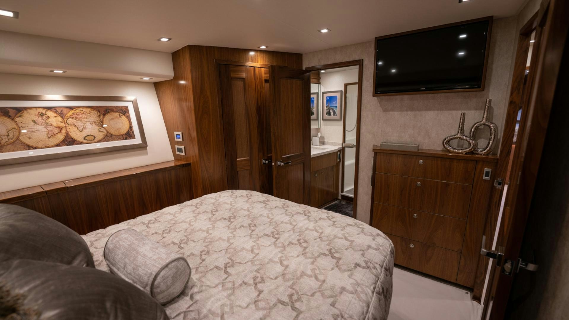 a bedroom with a bed and tv aboard WHY WOULDN'T WE Yacht for Sale