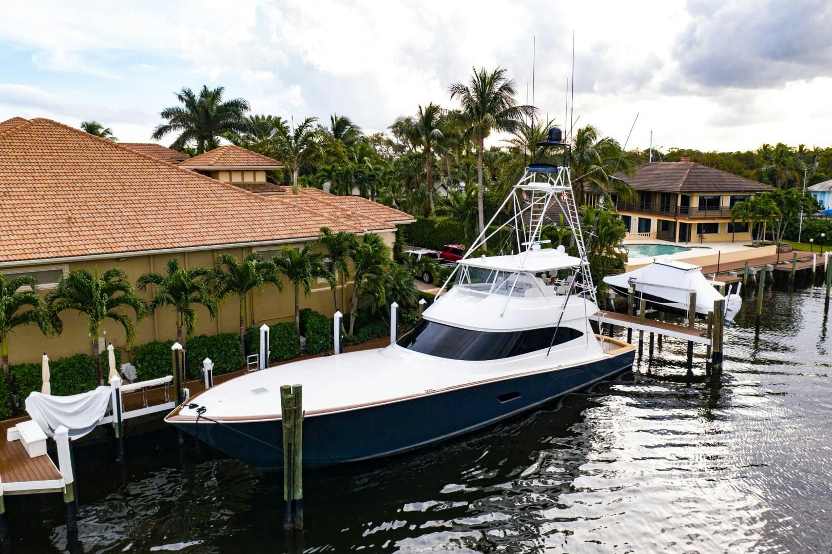a boat docked at a pier aboard WHY WOULDN'T WE Yacht for Sale
