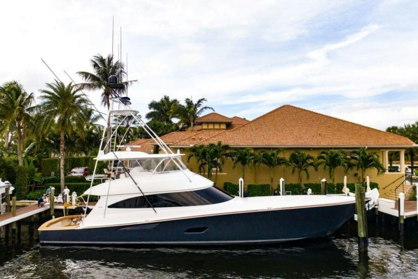 a boat docked at a pier aboard WHY WOULDN'T WE Yacht for Sale