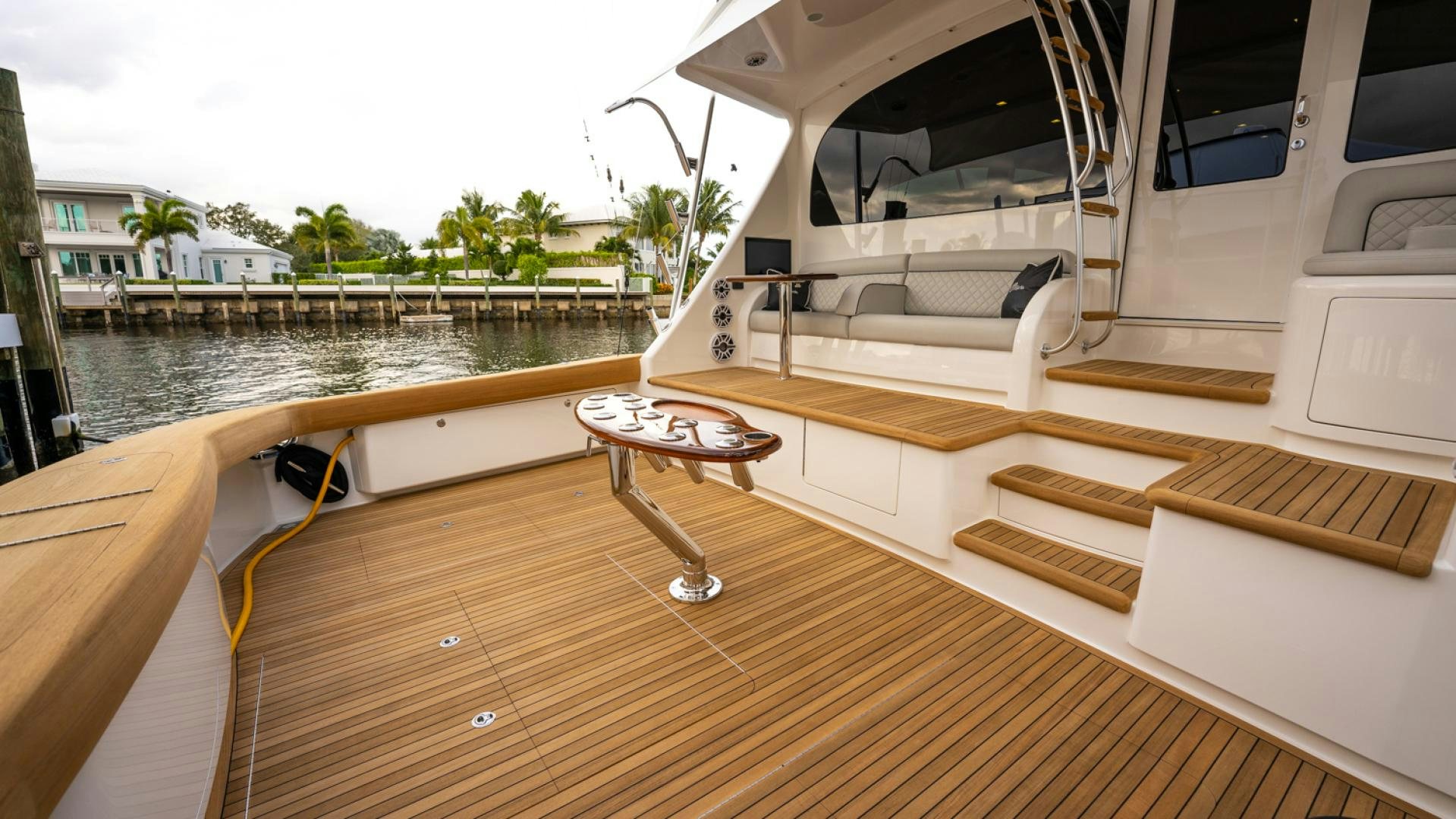 a deck with a table and chairs aboard WHY WOULDN'T WE Yacht for Sale