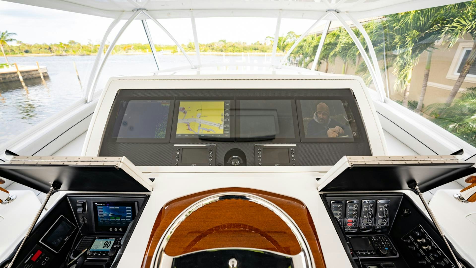 a person driving a car aboard WHY WOULDN'T WE Yacht for Sale