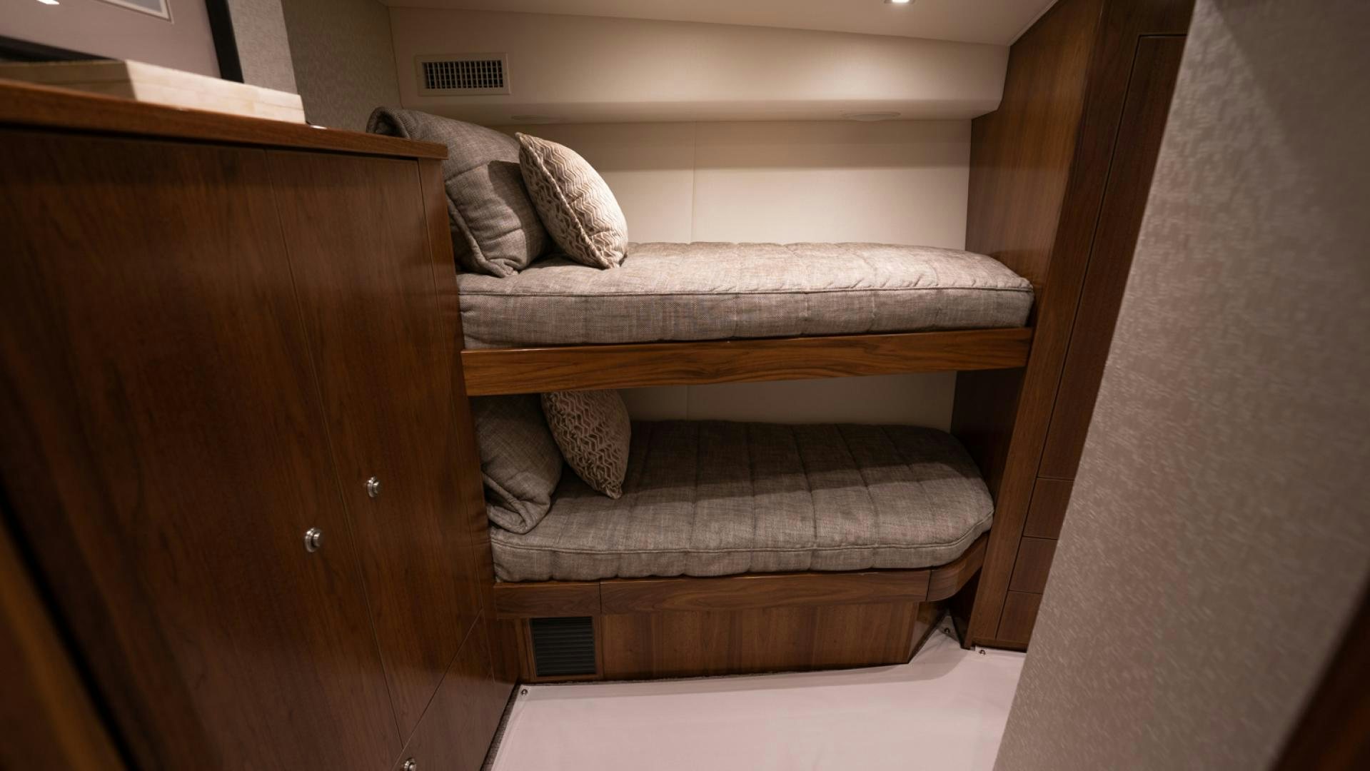 a couch with a pillow on it aboard WHY WOULDN'T WE Yacht for Sale