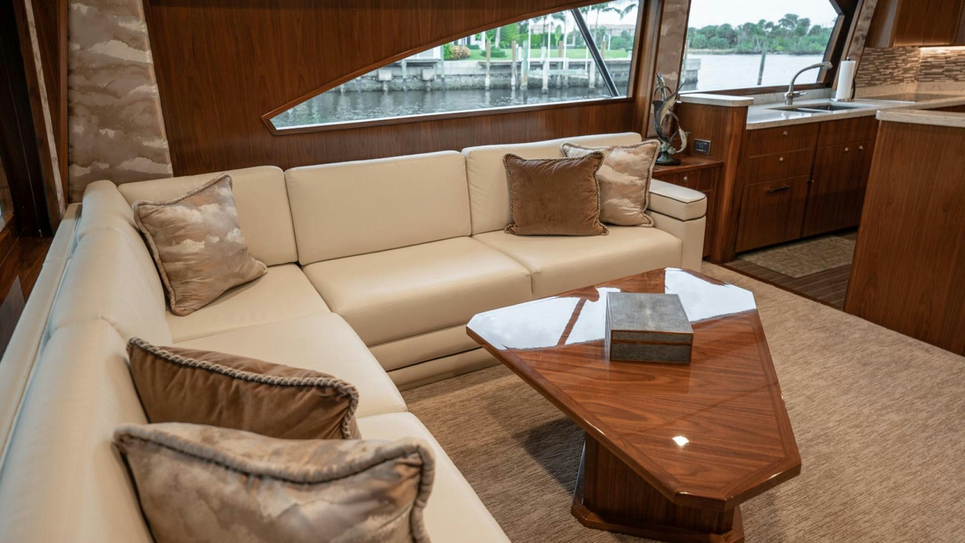 a living room with a couch and a table aboard WHY WOULDN'T WE Yacht for Sale