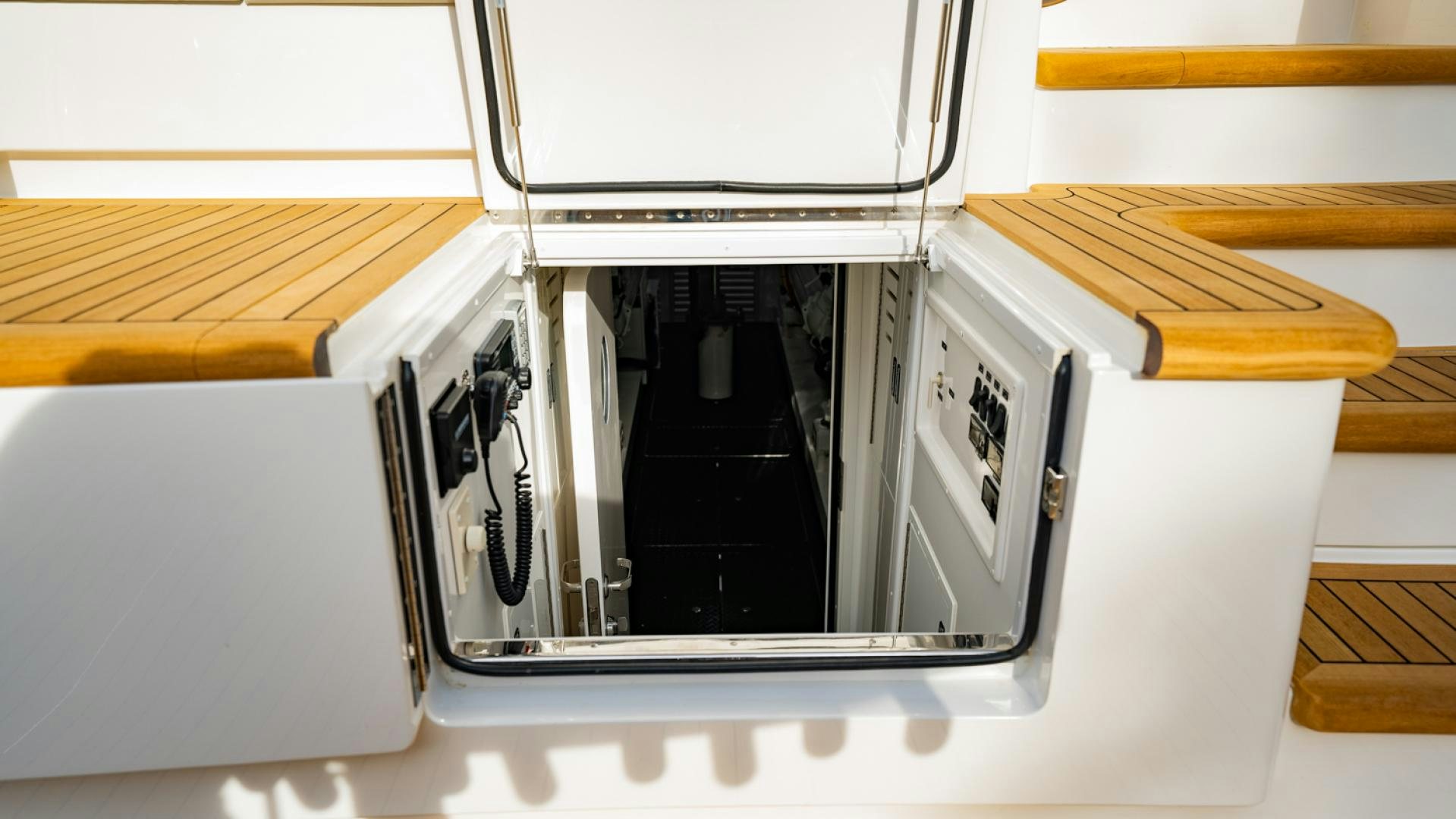 a white microwave with a door open aboard WHY WOULDN'T WE Yacht for Sale