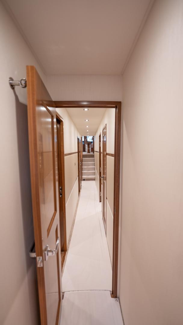 a hallway with a door aboard WHY WOULDN'T WE Yacht for Sale