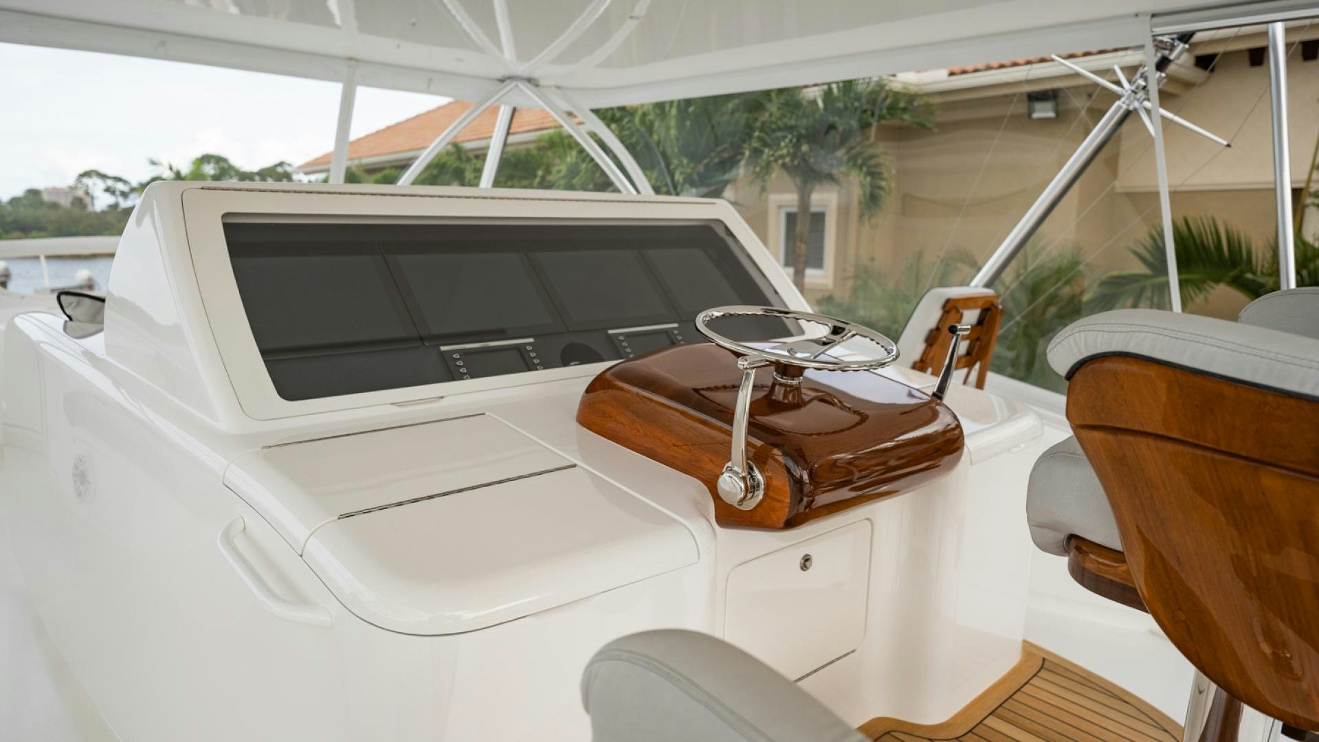 a white car with a brown leather seat and a white umbrella aboard WHY WOULDN'T WE Yacht for Sale