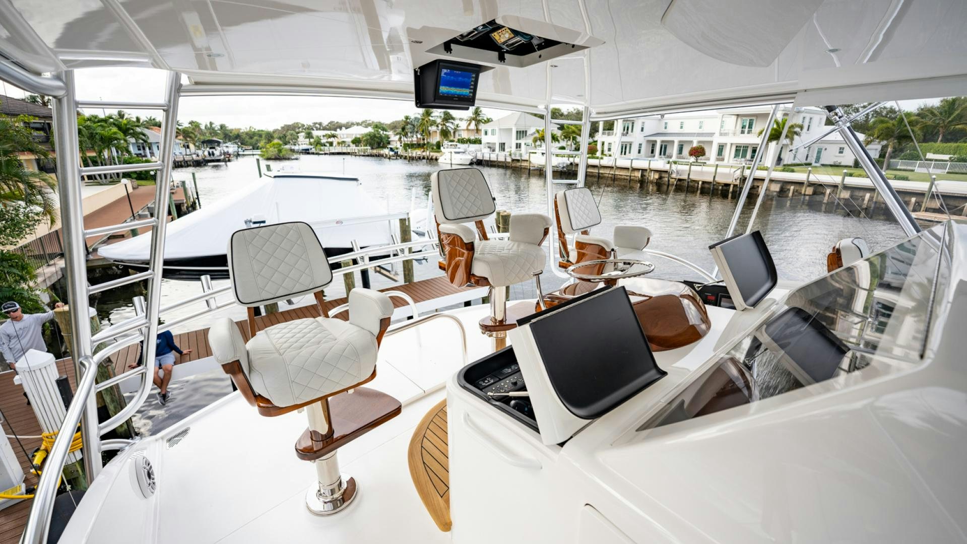 a large white tent with chairs and computers on it aboard WHY WOULDN'T WE Yacht for Sale