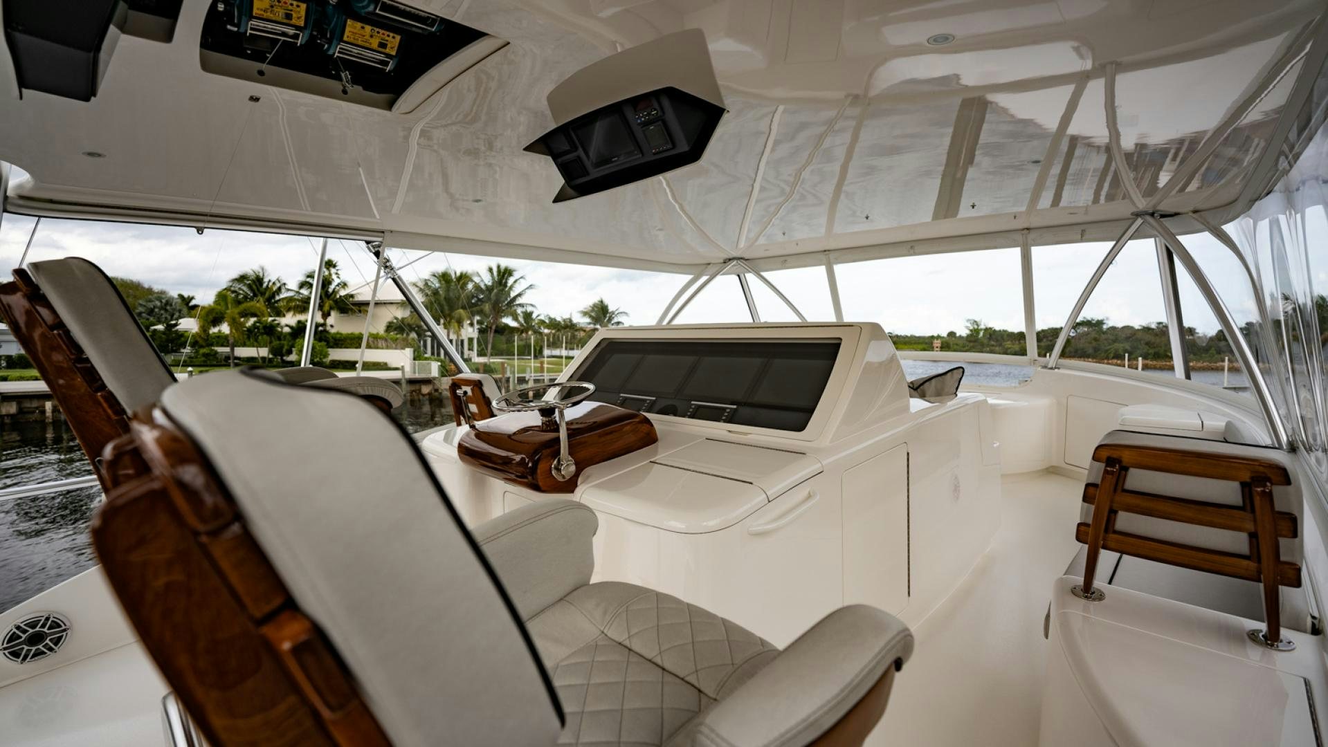 a white tent with a white tent and a wooden table and chairs aboard WHY WOULDN'T WE Yacht for Sale