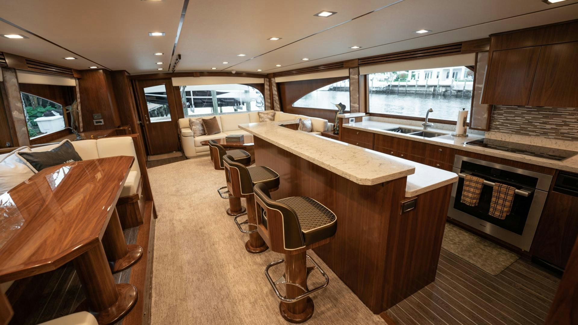 a kitchen with a table and chairs aboard WHY WOULDN'T WE Yacht for Sale