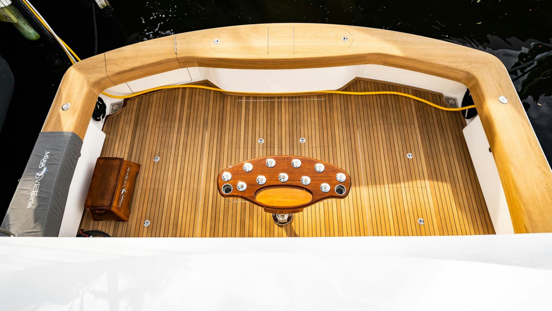 a wooden guitar with a red and white neck aboard WHY WOULDN'T WE Yacht for Sale